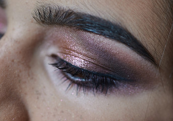 Obraz premium portrait of young beautiful woman's eye zone make up