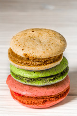 big beautiful pink box with sweets on wooden background