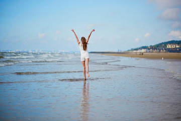 Young woman enjoying her vacation by sea