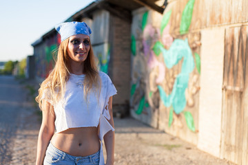 young woman in torn t shirt posing