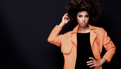 Fashionable woman in orange coat.