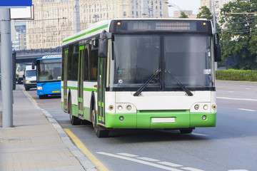 Plakat city bus goes along street