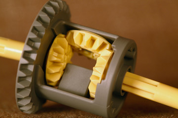 Plastic differential gears on a background 