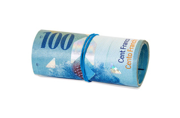 Banknotes of 100 swiss franc rolled with rubber