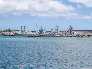 Fototapeta premium United States naval ships in Pearl Harbor USA. Pearl Harbor is the headquarters of the United States Pacific Fleet.