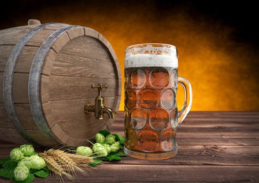 glass of oktoberfest beer with keg, barley and hops. 3D render