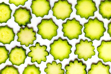 Zucchini cut into slices on white plate