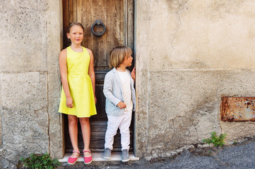Fototapeta na wymiar Outdoor portrait of adorable fashion kids