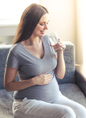 Beautiful pregnant woman at home