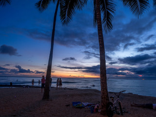 Waikiki beach in Honolulu Hawaii at sunset.