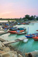 Fototapeta na wymiar fishermen harbor and Colorful twilight inevening over seascape a