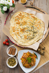 arabic oqda and Malawah bread top down view