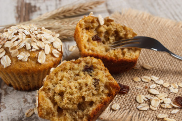 Fresh muffins with oatmeal baked with wholemeal flour and ears of rye grain, delicious healthy dessert