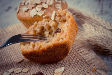 Vintage photo, Fresh muffins with oatmeal baked with wholemeal flour and ears of rye grain, delicious healthy dessert