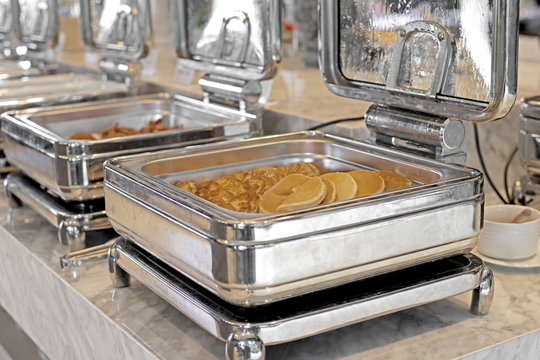 food service steam pans on buffet table