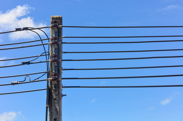 Electrical poles in white cloud and blue sky