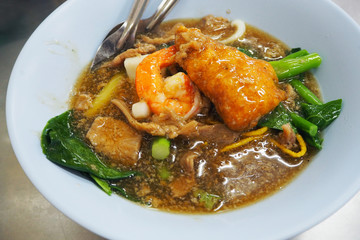 Rad Na or stirred fried noodle with pork and shrimp