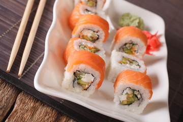 Uramaki salmon roll with avocado - Philadelphia close-up. Horizontal
