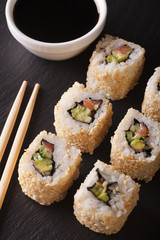 Japanese california roll served with soy sauce closeup. vertical top view
