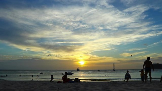 activity of tourist on the beach in sunset time
