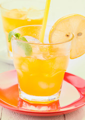 refresher glasses with lots of ice, on wood