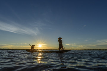 Silhouette of Fishermen in Thailand