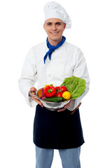 Male caterer ready to wash vegetables.