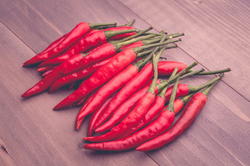 red chillies pepper on the wooden floor