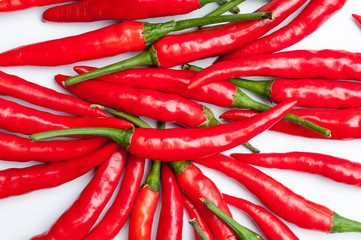 Red hot chili peppers on white background