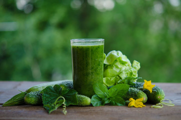 Green smoothie with cucumber, mint, zucchini and cabbage as heal