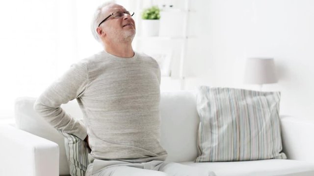 unhappy senior man suffering from backache at home 134