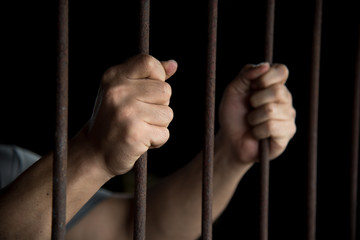 Hands of the prisoner in jail