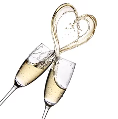 Fotobehang Glasses of champagne with heart shape splash isolated on a  white background © gtranquillity