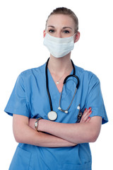 Confident female doctor in surgical mask.