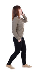 side view of a woman walking with a mobile phone. back view of girl in motion.  backside view of person.  Rear view people collection. Isolated over white background. Laughing girl with a phone in his