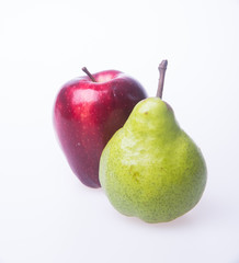 red apple and green pear on a background.