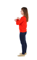 back view of standing young beautiful  woman.  girl  watching. Rear view people collection.  backside view of person.  The girl in the red sweater is left side 