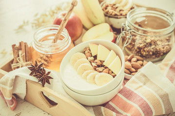 Autumn granola with banana apples and almond