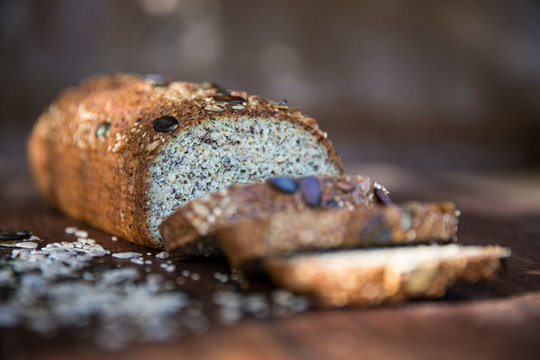 Fresh sliced seeded gluten free loaf on table