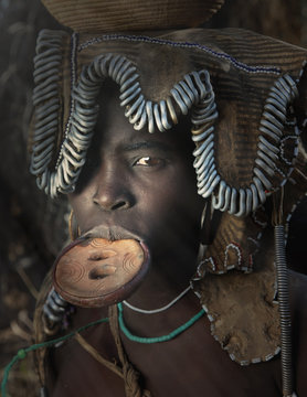 Woman of the Mursi Tribe with disc in her lower lip, Omo Valley, Ethiopia