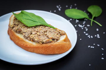 Single sandwich with pate from liver, carrot, spinach and eggs i