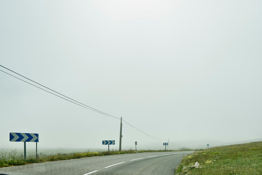 Landscape and empty arrow signed rural road, Gourdon, Alpes Maritimes, France