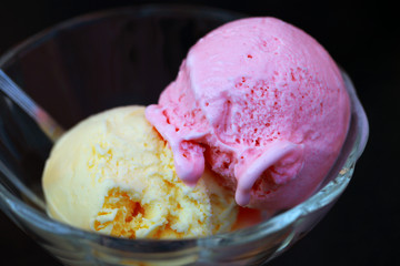 Ice cream scoops in glass bowl