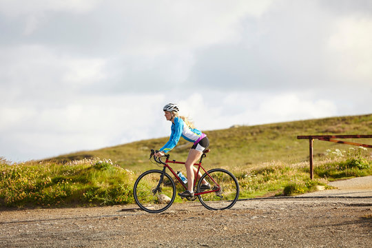 Cyclist riding on gravel road