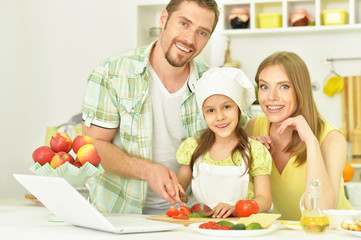 happy family cooking  in kitchen