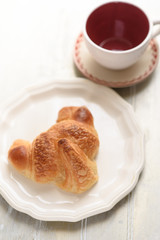 Croissant and coffee cup