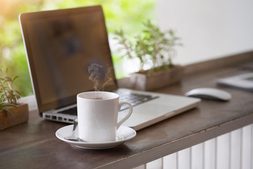Coffee mug - vintage effect style pictures on the work table in