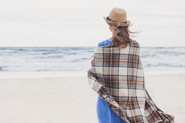 Young woman looking at the sea. Relaxation concept