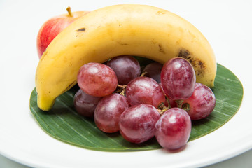 fruit in a plate on a white background