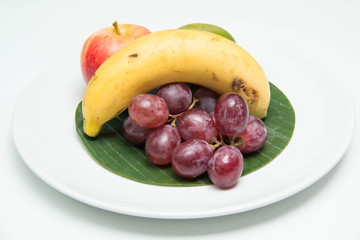 fruit in a plate on a white background